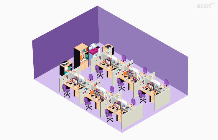 Office desks with computers and equipment tracked by an office asset management solution